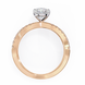 Rose gold ring with a diamond on a white background