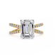 Diamond ring with emerald-cut center stone and gold band on a white background