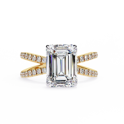 Diamond ring with emerald-cut center stone and gold band on a white background