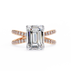 Diamond ring with rose gold band on a white background
