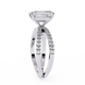 Diamond ring with a rectangular center stone on a white background