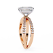 Rose gold ring with diamond accents on a white background