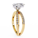Gold ring with a diamond on a white background