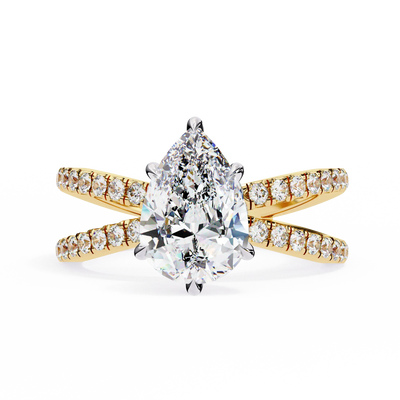 Gold ring with a pear-shaped diamond and smaller diamonds on a white background