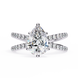 Diamond ring with a pear-shaped center stone on a white background