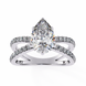 Diamond ring with a pear-shaped center stone on a white background