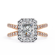 Rose gold ring with a large diamond and smaller diamonds on the band against a white background