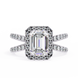 Diamond ring with emerald-cut center stone and halo on a white background