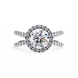 Diamond ring with a halo and surrounding stones on a white background