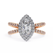 Rose gold ring with a large diamond and smaller diamonds on the band against a white background