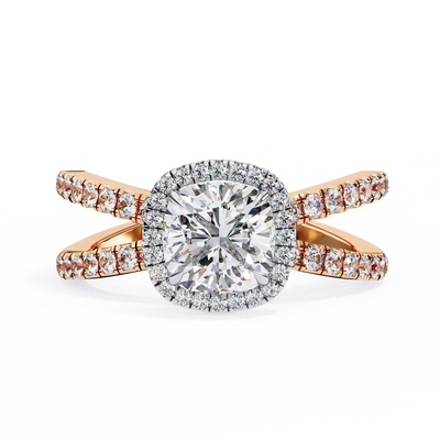 Gold ring with a large diamond and smaller diamonds on the band against a white background
