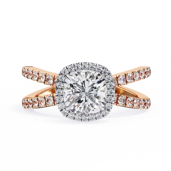 Gold ring with a large diamond and smaller diamonds on the band against a white background
