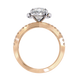 Rose gold ring with diamond accents on a white background