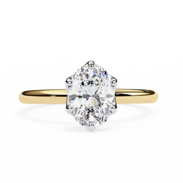 Gold ring with a large diamond on a white background