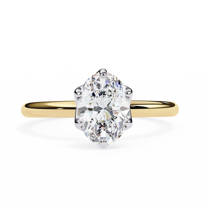 Gold ring with a large diamond on a white background