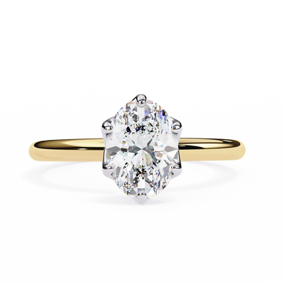 Gold ring with a large diamond on a white background