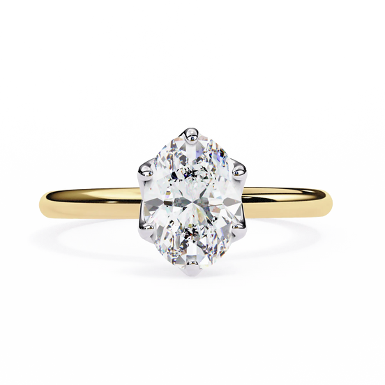 Gold ring with a large diamond on a white background