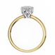 Two-tone gold ring with a diamond on a white background