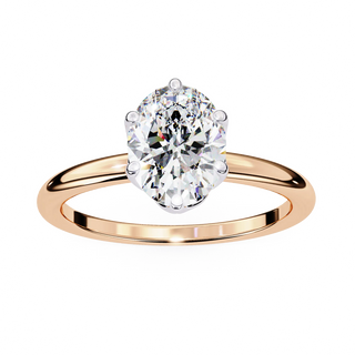 Rose gold ring with a large diamond on a white background