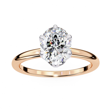 Rose gold ring with a large diamond on a white background