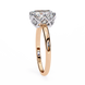 Rose gold ring with a diamond on a white background
