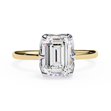 Gold ring with a large emerald-cut diamond on a white background