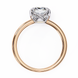 Rose gold ring with a heart-shaped diamond on a white background
