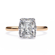 Rose gold ring with a large diamond on a white background