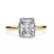 Gold ring with a large diamond on a white background