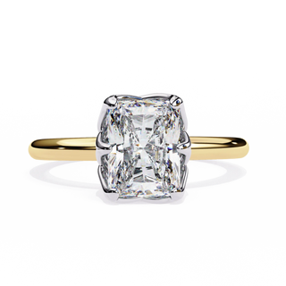 Gold ring with a large diamond on a white background