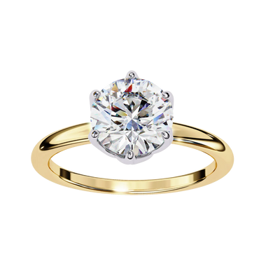 Gold ring with a large diamond on a white background