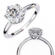 Classic round solitaire diamond engagement ring in white gold featuring a 1.56 CT round brilliant center stone with six-prong cathedral setting and hidden accent diamonds.