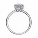 Classic round solitaire diamond engagement ring in white gold featuring a 1.56 CT round brilliant center stone with six-prong cathedral setting and hidden accent diamonds.