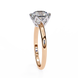 Rose gold ring with a diamond on a white background