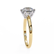Gold ring with a diamond on a white background
