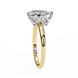 Gold ring with a diamond on a white background