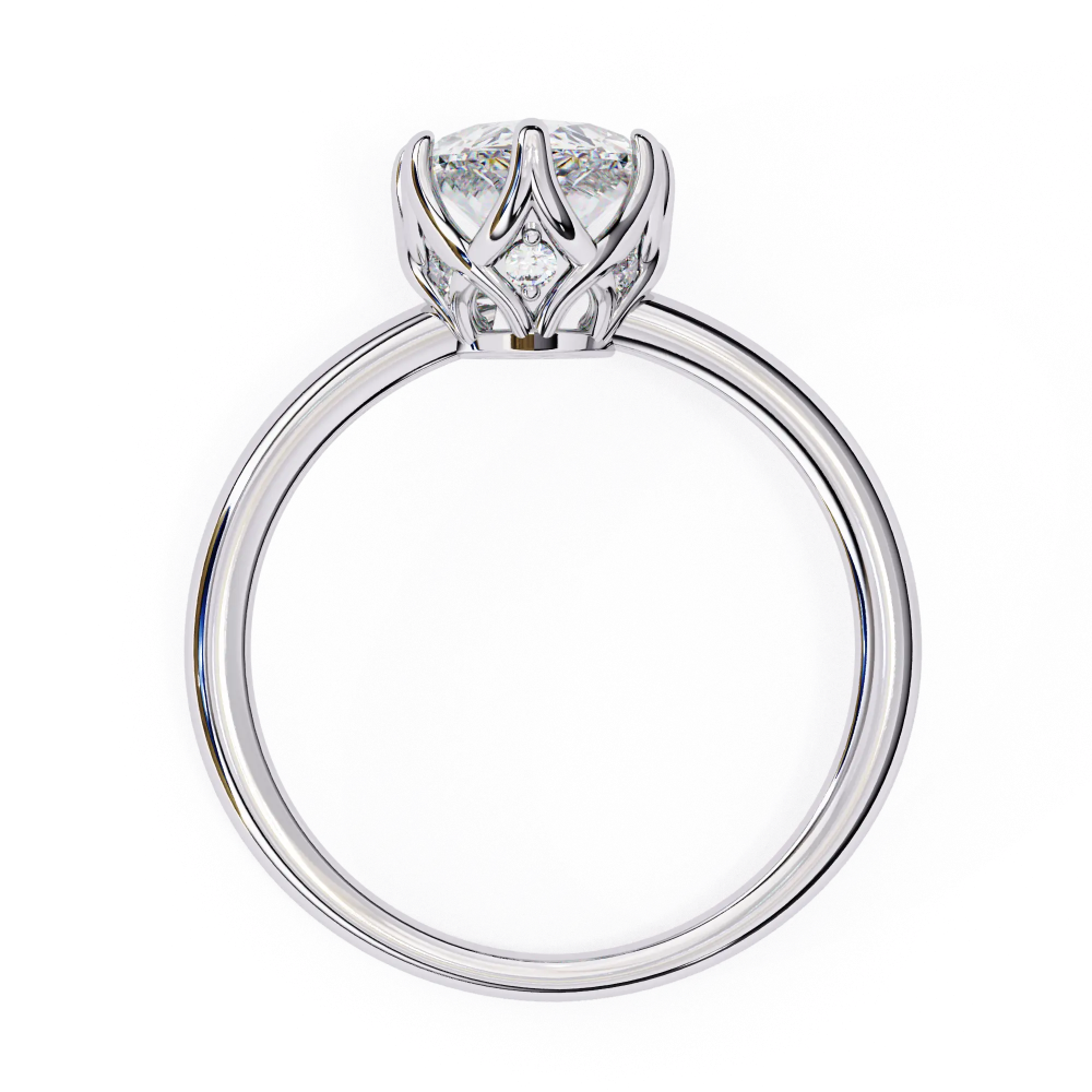 Silver ring with a heart-shaped diamond on a white background