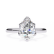 Diamond ring with pear-shaped gemstone on a white background