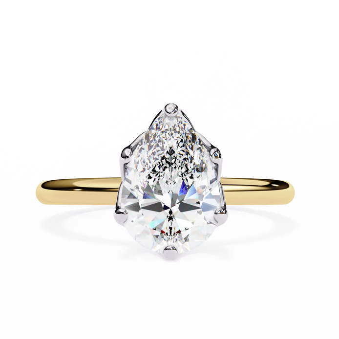 Gold ring with a pear-shaped diamond on a white background