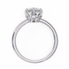 Silver ring with a heart-shaped diamond on a white background