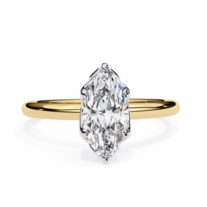Gold ring with a marquise-shaped diamond on a white background