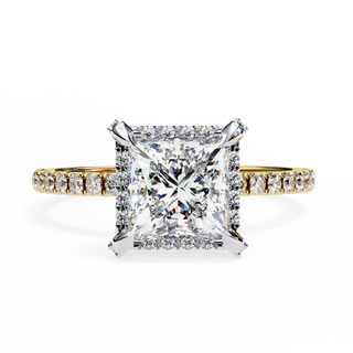 Diamond ring with a large central gemstone and smaller stones on a white background