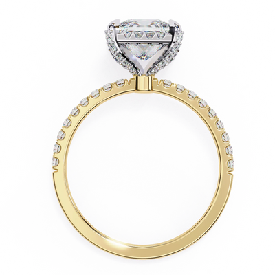 Gold ring with a heart-shaped diamond on a white background