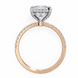 Rose gold ring with a heart-shaped diamond on a white background