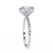 Diamond ring with a halo-style setting on a white background