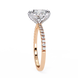 Rose gold ring with diamond band on a white background
