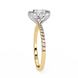 Gold ring with a diamond on a white background