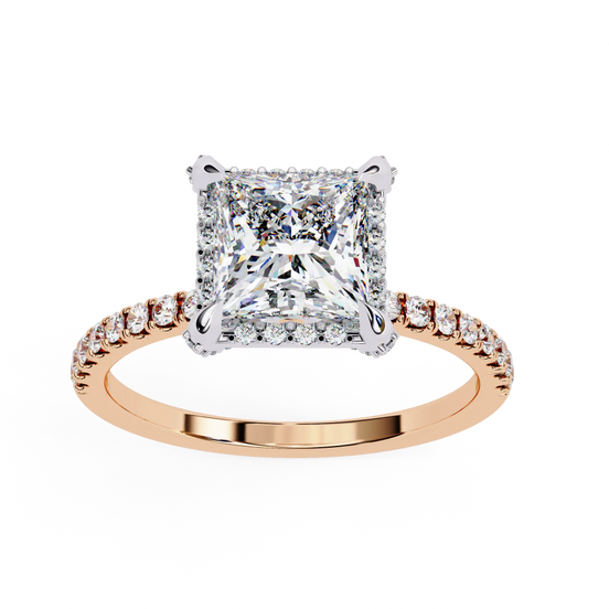 Rose gold ring with a large diamond and smaller diamonds on the band against a white background