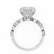 Diamond ring with a heart-shaped center stone on a white background