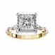 Gold ring with a large diamond and smaller diamonds on the band against a white background